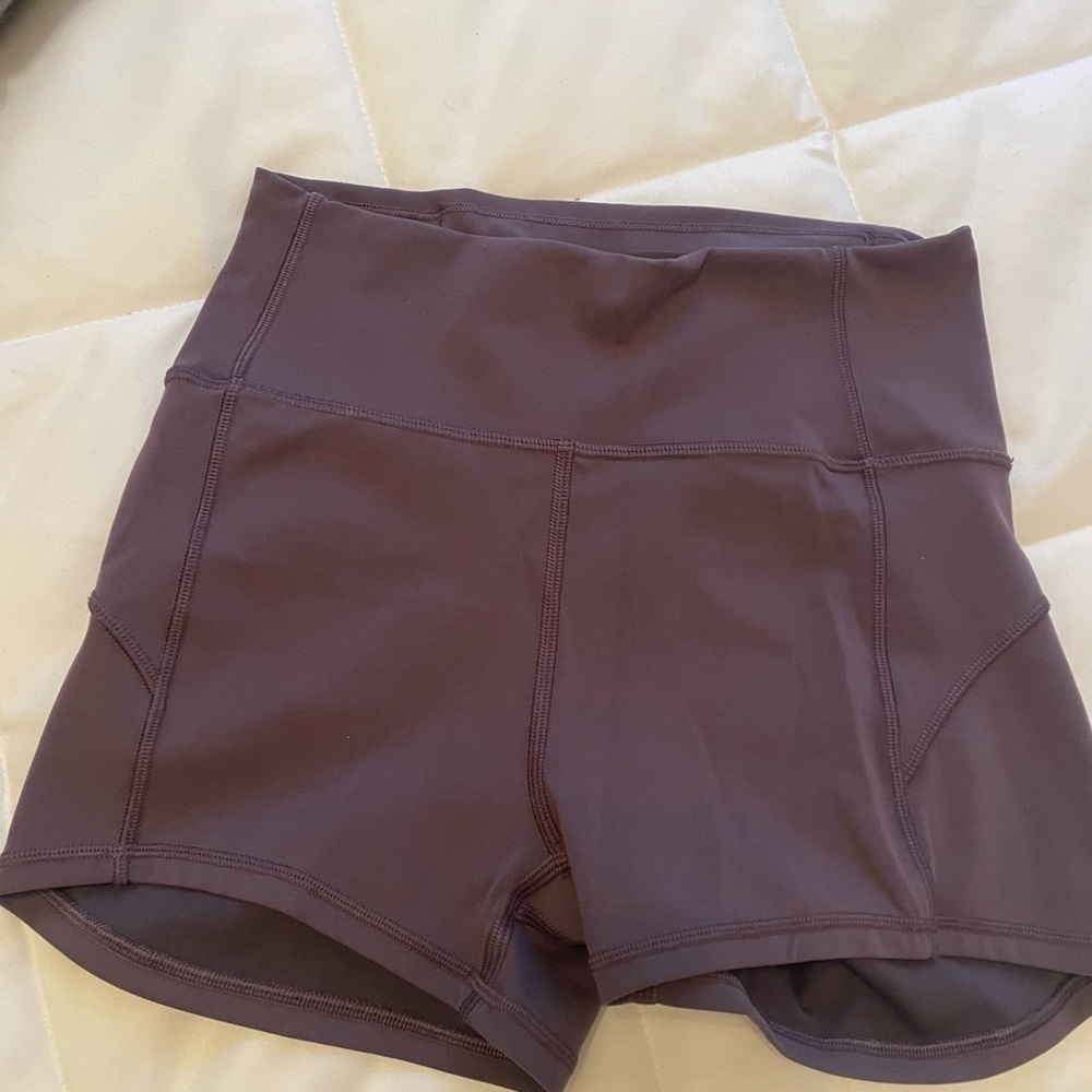 Lululemon purple tight short shorts, size 4